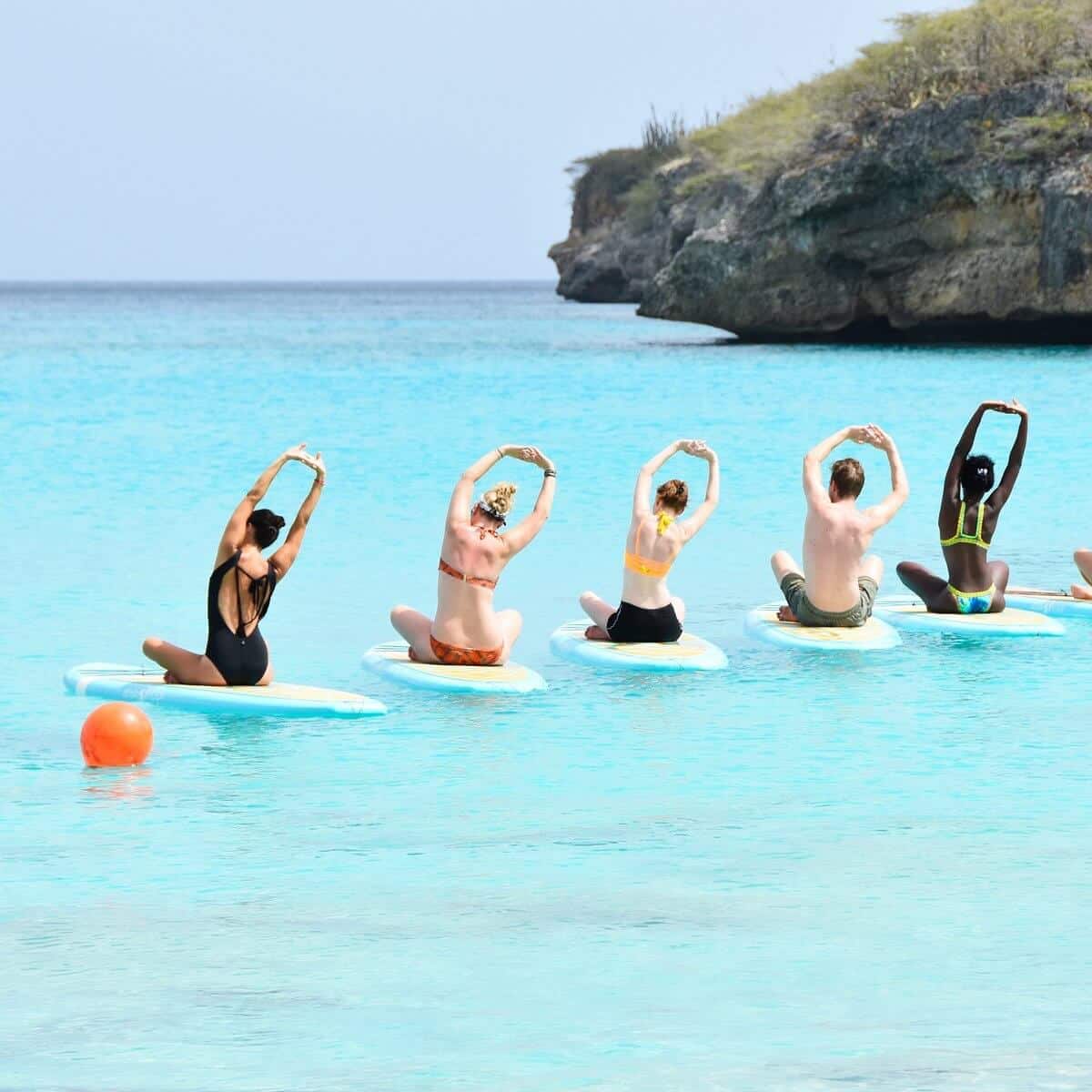 Group of people sitting a paddle boards in Curaçao